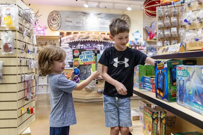 Two children shopping at the Brass Ring Gift Shop.
